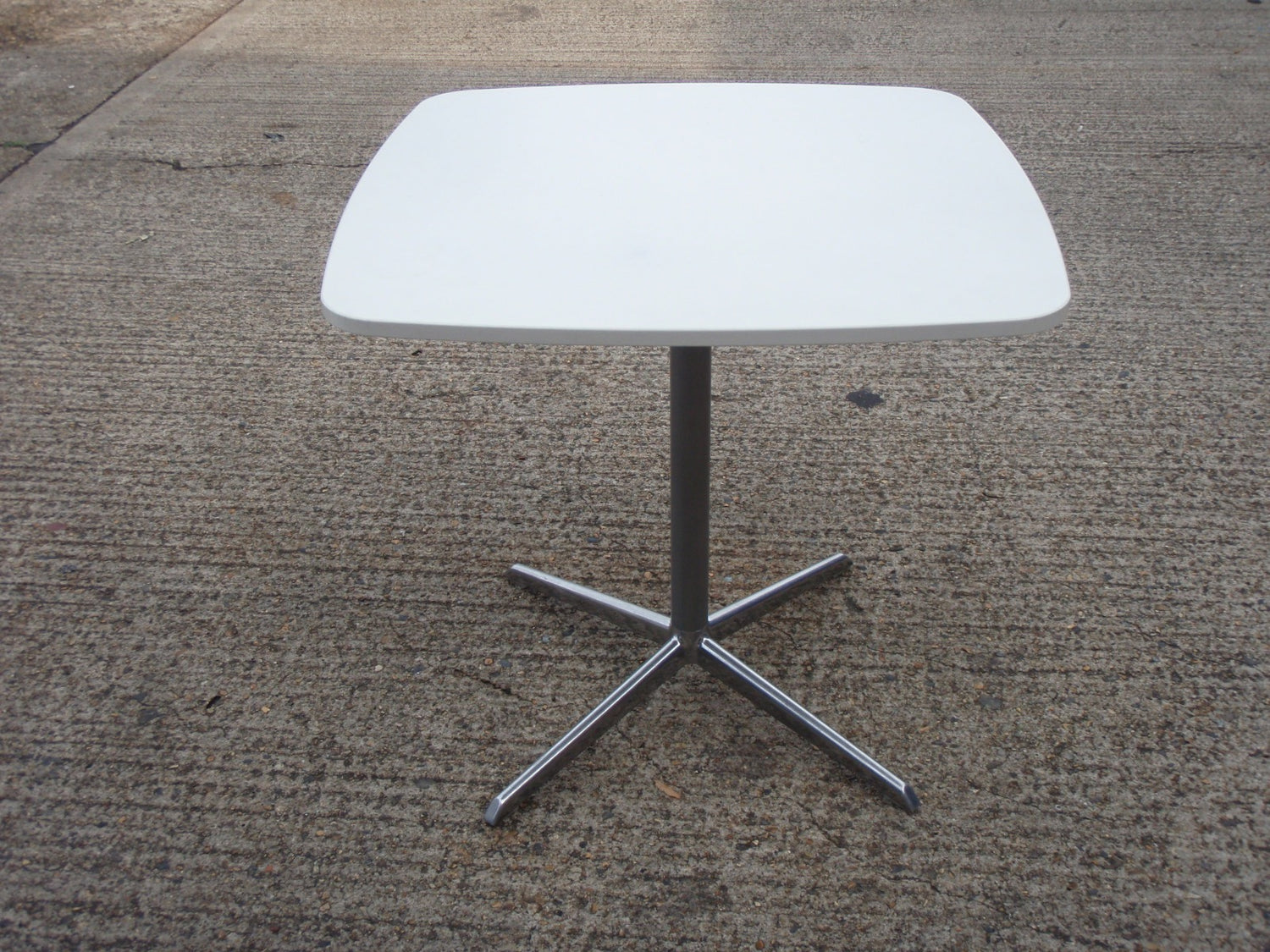 White Pedestal Base Table