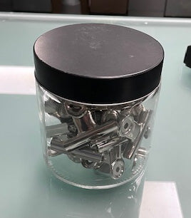 Clear Glass Tub of Bulldog Clips